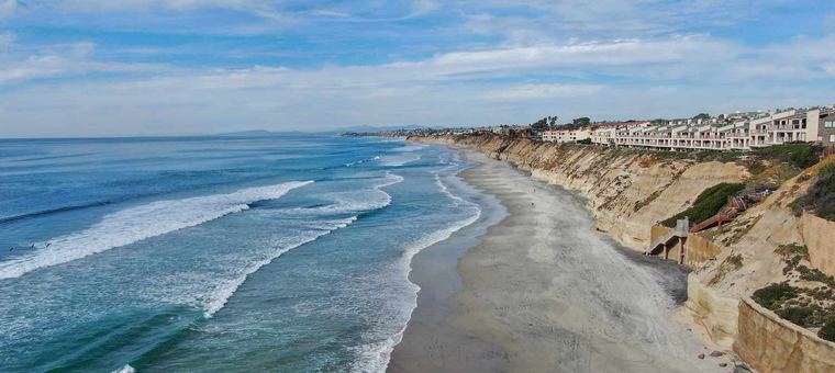 condos on a cliff overlooking the ocean